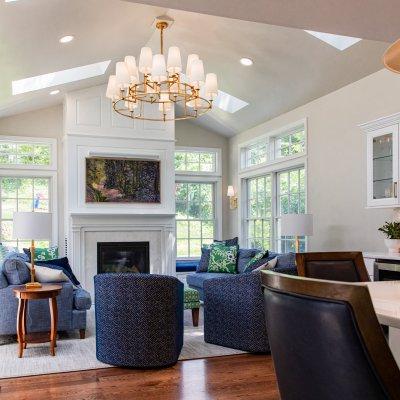 Family room addition; sunlights; vaulted ceiling; green, blue, white with gold chandelier Wilcox Architecture