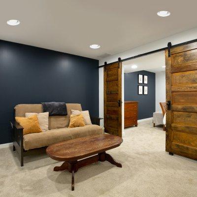 Basement renovation with sliding wood doors  